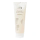 A tube of 100% Pure Coconut Milk Restorative Shampoo on a solid white background.