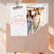 Nourished Life Spring Beauty Box card in a kraft envelope with a photo of three women on it, with pink balloons behind, clear product photo