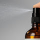 Close up of the ultra-hydrating mist being sprayed into the air.