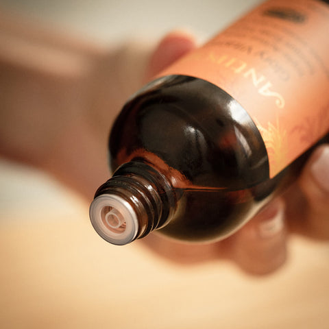 Close up of antipodes glory toner with lid off and showing dropper mechanism with blurred background.