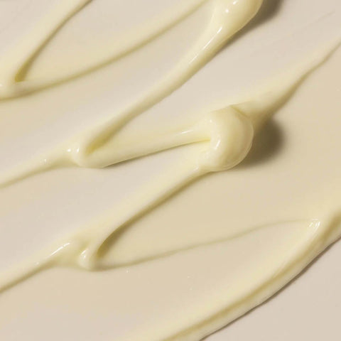 Close-up of smooth, creamy white swatch of grace gentle cream cleanser & makeup remover.