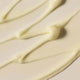 Close-up of smooth, creamy white swatch of grace gentle cream cleanser & makeup remover.
