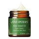 A jar of Antipodes Kiwi Seed Oil Eye Cream with a green label displaying the product name, brand name and a leaf design.