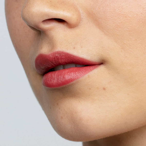 Boom rock bronze lipstick swatch on a person's lips.