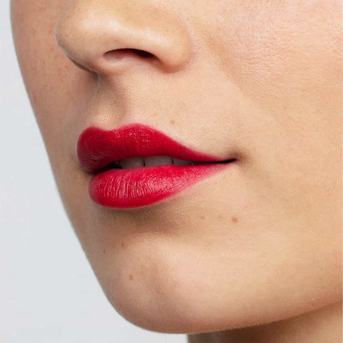 Ruby bay rouge lipstick swatch on a person's lips.