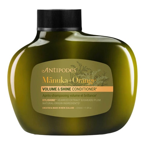 Antipodes Manuka + Orange Volume & Shine Conditioner bottle on a white background.