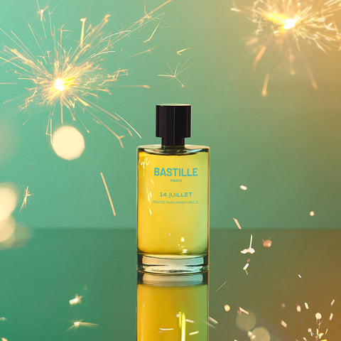 100ml bottle Bastille 14 Juillet Perfume, natural vegan perfume with a fireworks background.