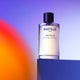 100ml bottle Bastille Bataille Perfume, natural vegan perfume styled with a colourful background.