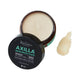 Black Chicken Remedies Axilla Deodorant Paste Original 75g open tin showing cream paste, with the lid in front and a dab of paste beside it on white