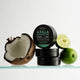 Black Chicken Remedies Axilla Deodorant Paste Original Plastic Free 60g stack of black tins beside half a coconut and limes, styled shot