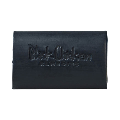 Black Chicken Remedies D-Bar Activated Charcoal Detox Soap 100g black soap bar with the Black Chicken name embossed on it on a plain white background