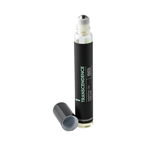Black Chicken Remedies Essential Oil Perfume #1 Transcendence slim roller bottle lying with its cap beside it on a plain white background