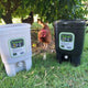 Two Bokashi One buckets on grass with a chicken in the background.