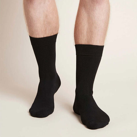 Black everyday crew socks worn by a man.