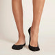 Black everyday liner socks worn by a female model.