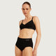 Boody Period & Leak Proof Full Briefs Light-Moderate Black lifestyle shot of a woman with her hair up in a black bra and the black full briefs