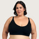 Boody Seamfree Crop Bra Black lifestyle shot of a woman with short dark hair wearing the black bra, front view, styled lifestyle photo