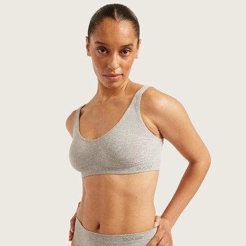 Boody Seamfree Crop Bra Light Grey Marl lifestyle shot of a woman in the grey marl bra and briefs, front view, styled lifestyle photo