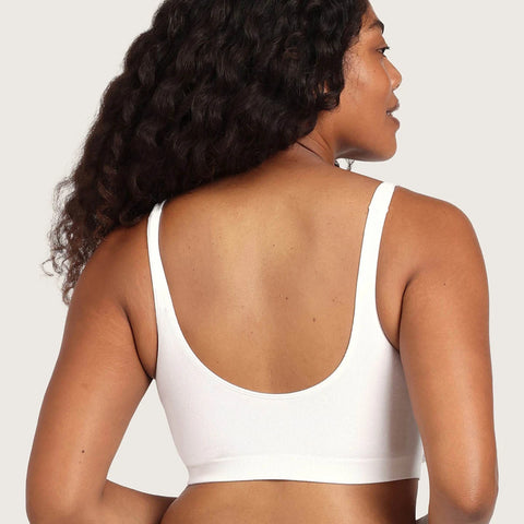 Boody Seamfree Crop Bra White lifestyle back view of a woman with long curly hair in the white bra, styled lifestyle photo, single image