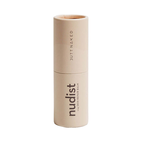Butt Naked Body Nudist Repair Balm 14g in a cream coloured stick tube with the word nudist, standing upright on a plain white background