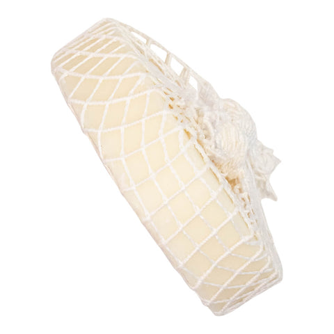 Downunder Wash Co. Tuffy Stain Remover with Net Lemon Eucalyptus 120g round bar in a cream net bag, seen from the side on a plain white background