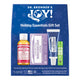 Dr. Bronner's Joy! Holiday Essentials Gift Set in a blue box, containing a bottle of Magic Soap Rose, a bar of Magic Bar Soap Lavender, a tube of All-One Toothpaste, and a tube of Alloe Lip Balm.
