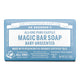 Bar of soap with a blue label on a towel next to a sink
