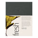 Dr. Hauschka Fresh Gift Set, featuring a dark gray top section with the brand name and a lower cream-colored section with text and a leaf graphic.