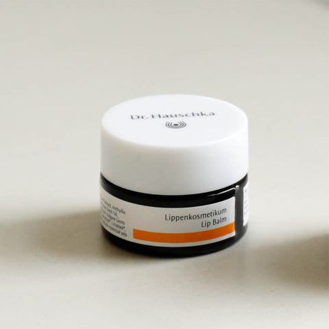 Dr. Hauschka lip balm jar on a white background