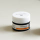 Dr. Hauschka lip balm jar on a white background