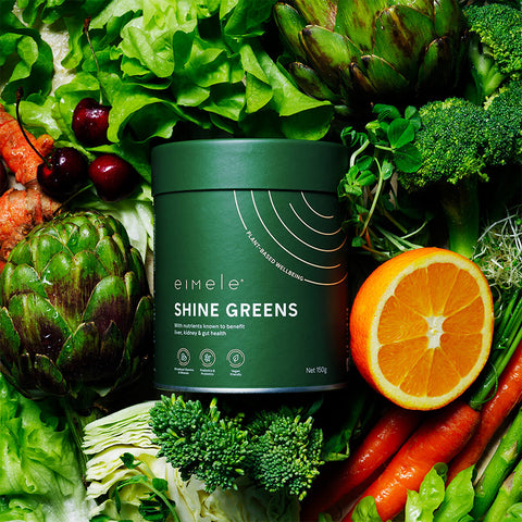 150g container eimele Shine Greens - Home Edition styled with vegetables.