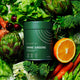 150g container eimele Shine Greens - Home Edition styled with vegetables.
