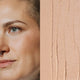 Model next to swatch of Elate Beauty Creme Concealer in the shade 'CN2', for light neutral skin tones. A two-in-one concealer and illuminator formulated with evening primrose oil, designed to heal and conceal blemishes.