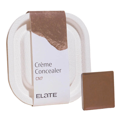 2.7ml pan of Elate Beauty Creme Concealer in the shade 'CN7', for deep neutral skin tones. A two-in-one concealer and illuminator formulated with evening primrose oil, designed to heal and conceal blemishes.