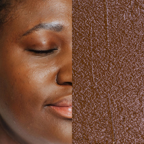 Model next to swatch of Elate Beauty Creme Concealer in the shade 'CW7', for deep warm skin tones. A two-in-one concealer and illuminator formulated with evening primrose oil, designed to heal and conceal blemishes.