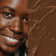 Elate Beauty Refresh Foundation 30ml RN8 lifestyle split image of a smiling woman with deep skin beside a swatch of dark brown foundation