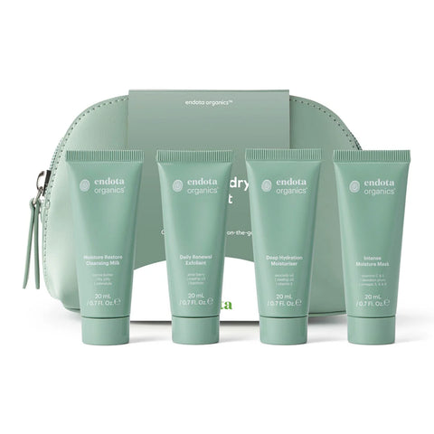 Set of Endota Organics skincare products with a green pouch on a white background