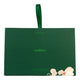 A dark green rectangular product box with a matching green ribbon handle, featuring the brand name 'endota' in light green text and a small floral illustration near the bottom right corner, set against a plain white background.