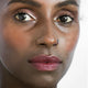 Ere Perez Almond Brow Pencil Perfect 1.1g lifestyle close up portrait of a woman with deep skin and neatly defined eyebrows, face only