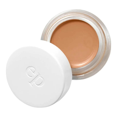 Ere Perez Arnica All-Cover Pot Brew 5g, an open white pot with its lid beside it showing warm caramel concealer, front view on white