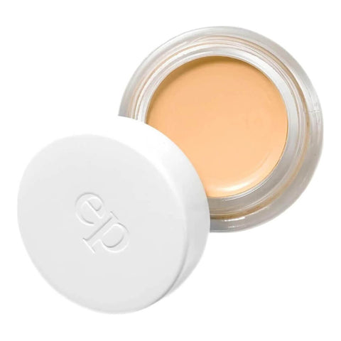 Ere Perez Arnica All-Cover Pot Honey 5g, an open white pot with its lid beside it showing light peach concealer, front view on white