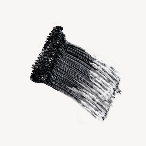 Ere Perez Avocado Waterproof Mascara Black swatch, a thick smear of black mascara, close up of the texture on a plain white background