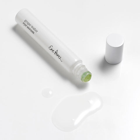 8ml Ere Perez Grape Water Eye Serum with a jade roller applicator. Clear serum to brighten eye area.