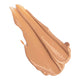 Ere Perez Lychee Crème Corrector 10ml Cinco swatch, a smear of caramel tan corrector, close up on a plain white background, clear product photo