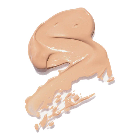Ere Perez Lychee Crème Corrector 10ml Tres swatch, a smear of light peach pink corrector, close up on a plain white background
