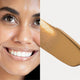 Ere Perez Oat Milk Foundation Brew lifestyle split image of a smiling woman with deep skin beside a swatch of caramel foundation