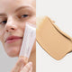 Ere Perez Oat Milk Foundation Honey lifestyle split image of a woman holding the tube beside a swatch of light beige foundation