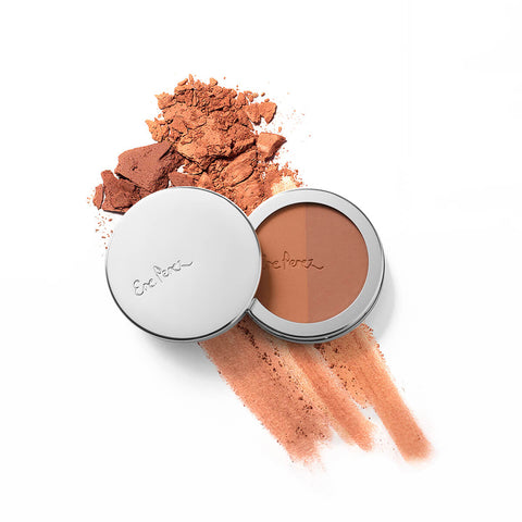 Ere Perez Rice Powder Blush & Bronzer Roma 9g compact beside crushed orange powder and a swatch streak, shown from above on white