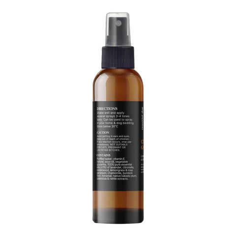 Essential Dog Citronella Guard Spray 125ml amber spray bottle turned to show the back label with small print on a plain white background