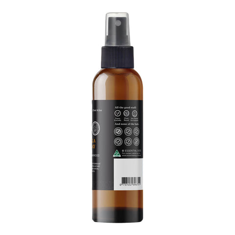 Essential Dog Citronella Guard Spray 125ml amber spray bottle turned to show the side label with a barcode on a plain white background